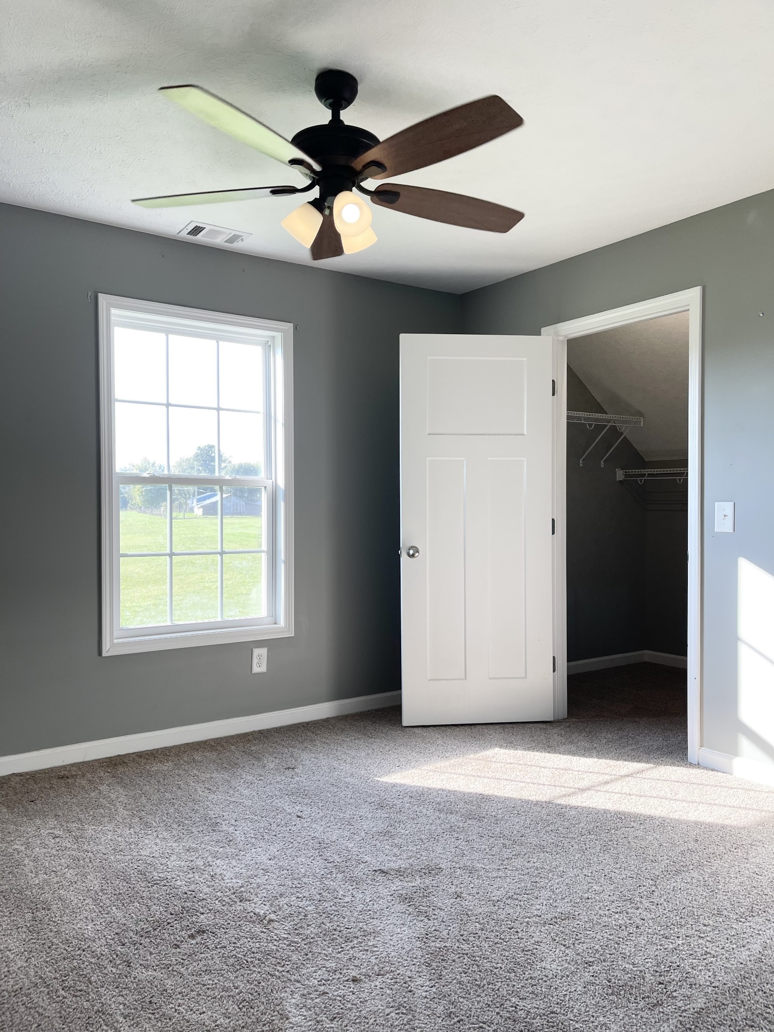 319 Riot Road Portland, TN 37148 - Photo 19 of 26 an empty room with a ceiling fan and a window