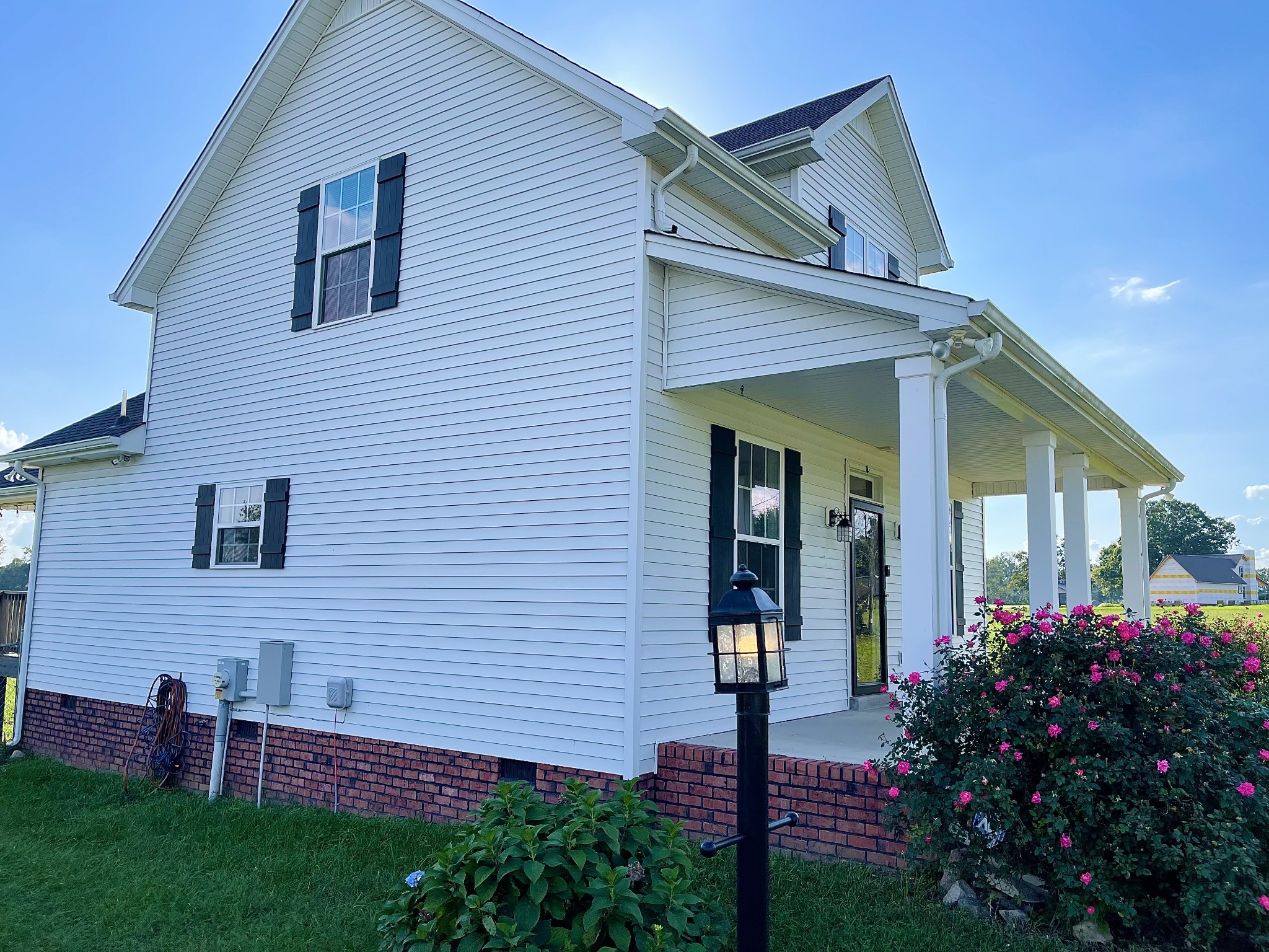 319 Riot Road Portland, TN 37148 - Photo 24 of 26 a view of a house with a small yard and flower plants