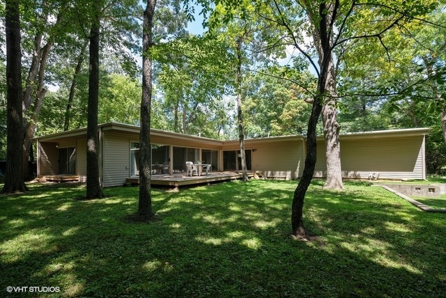 103 Crabtree Road East Dundee, IL 60118 - Photo 1 of 50 a backyard of a house with table and chairs