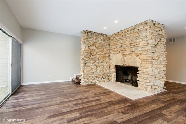 103 Crabtree Road East Dundee, IL 60118 - Photo 11 of 50 a view of an empty room with wooden floor and a fireplace
