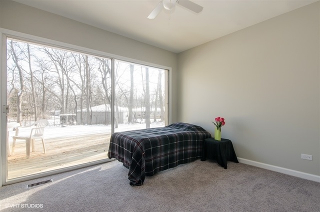 103 Crabtree Road East Dundee, IL 60118 - Photo 20 of 50 a spacious bedroom with a bed and a window