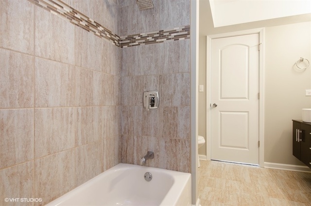 103 Crabtree Road East Dundee, IL 60118 - Photo 22 of 50 a bathroom with a shower curtain and a sink