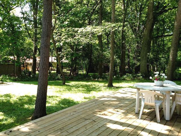 103 Crabtree Road East Dundee, IL 60118 - Photo 31 of 50 a view of a wooden dinning table and chairs in the patio