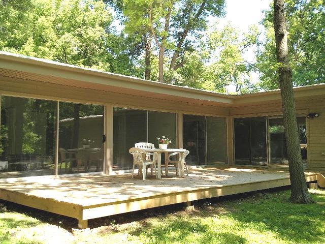 103 Crabtree Road East Dundee, IL 60118 - Photo 33 of 50 a view of a patio with table and chairs and floor to ceiling window