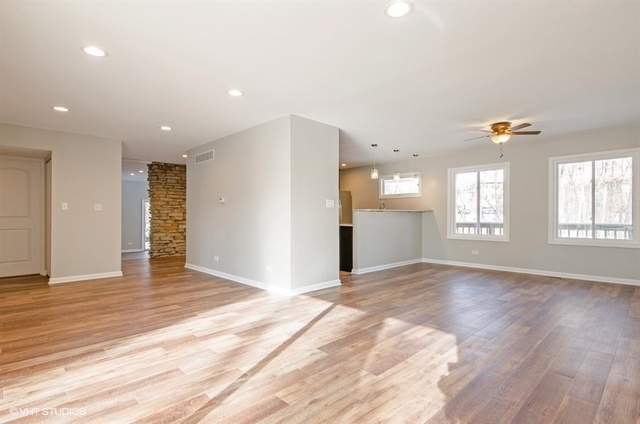 103 Crabtree Road East Dundee, IL 60118 - Photo 5 of 50 a view of an empty room with window and wooden floor