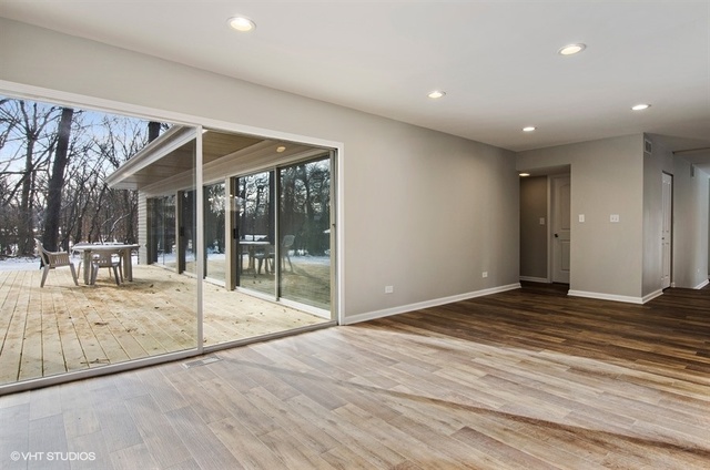 103 Crabtree Road East Dundee, IL 60118 - Photo 6 of 50 a view of a big room with wooden floor and windows