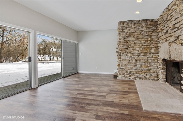 103 Crabtree Road East Dundee, IL 60118 - Photo 8 of 50 a view of an empty room with a fireplace and a window