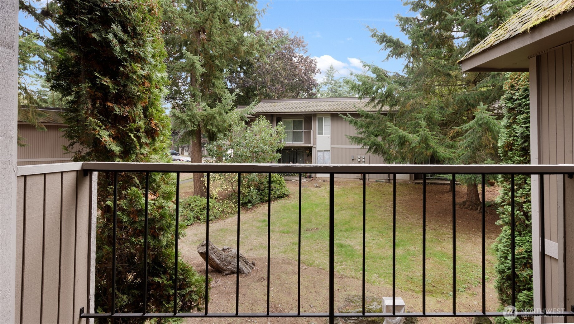 4601 Southwest 320th Street, Unit L6 Federal Way, WA 98023 - Photo 17 of 22 a view of a garden from a balcony