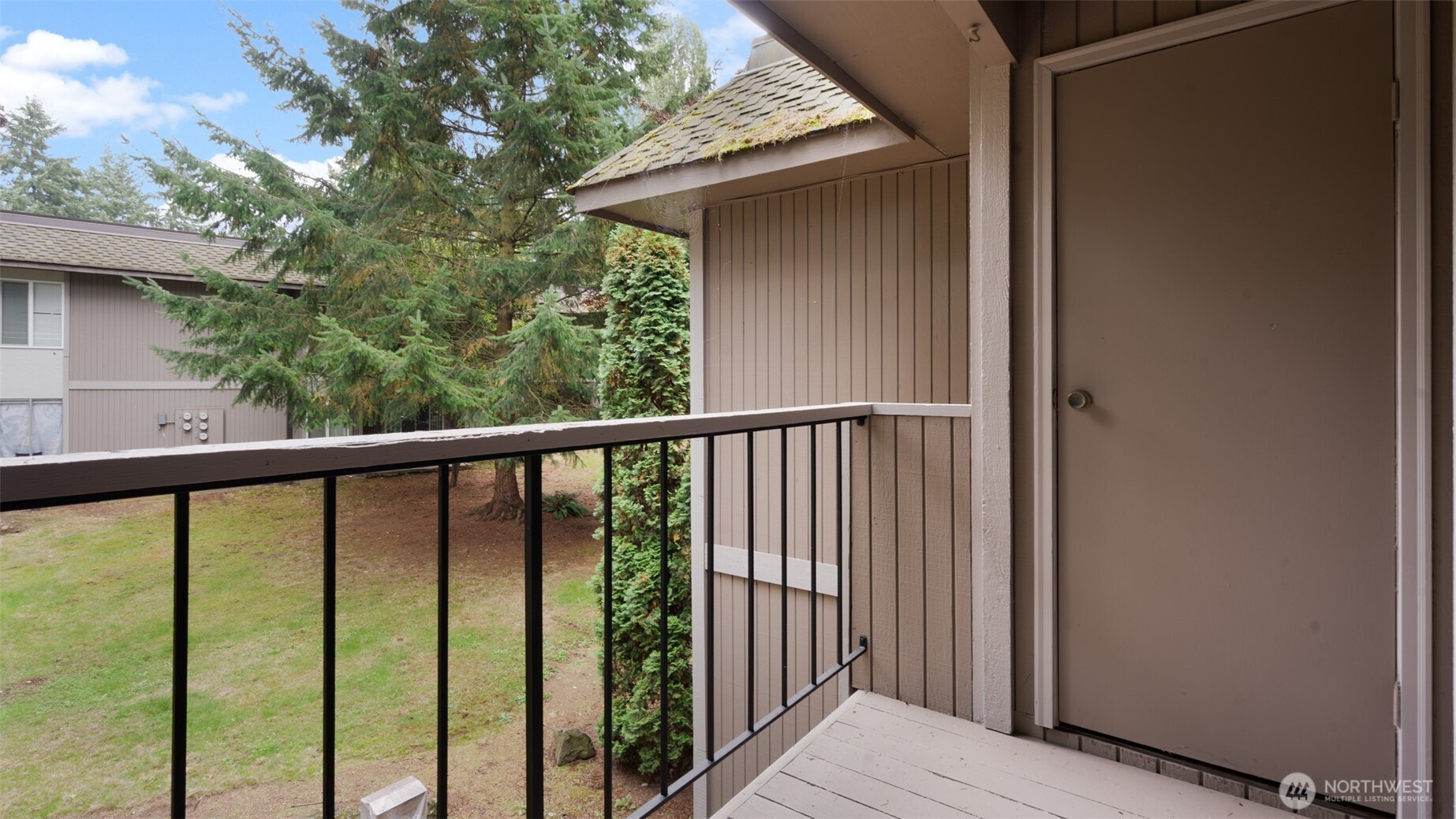 4601 Southwest 320th Street, Unit L6 Federal Way, WA 98023 - Photo 18 of 22 a view of balcony with wooden floor