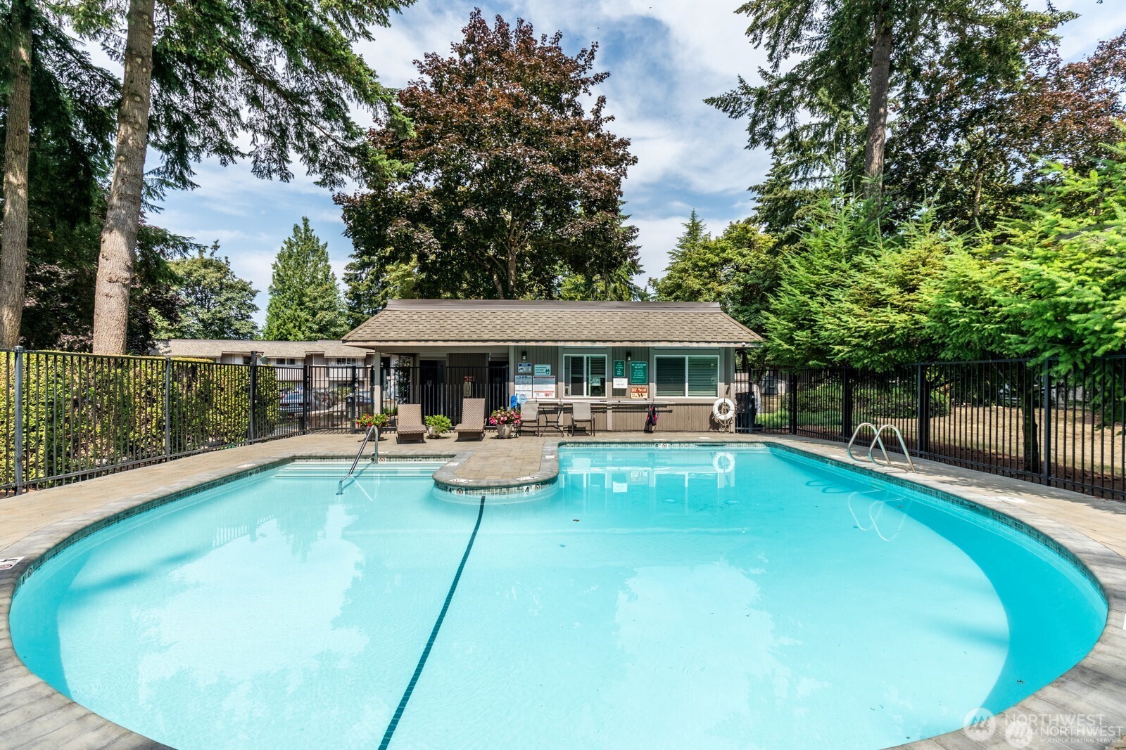 4601 Southwest 320th Street, Unit L6 Federal Way, WA 98023 - Photo 22 of 22 a view of a swimming pool with sitting area
