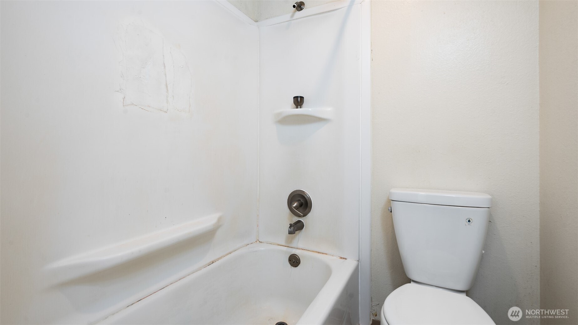 4601 Southwest 320th Street, Unit L6 Federal Way, WA 98023 - Photo 10 of 22 a bathroom with a toilet and a shower