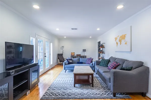 a living room with furniture and a rug