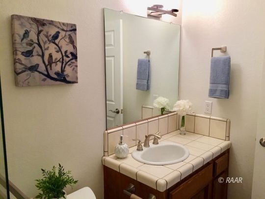 1108 Judy Way Ridgecrest, CA 93555 - Photo 31 of 35 a bathroom with a sink and a mirror