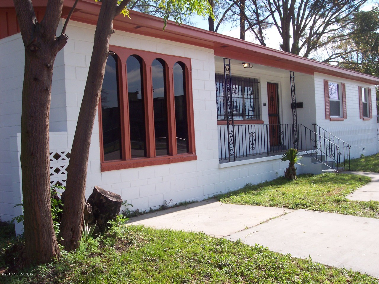 4725 Spring Park Road Jacksonville, FL 32207 - Photo 3 of 25 a front view of a house with a yard