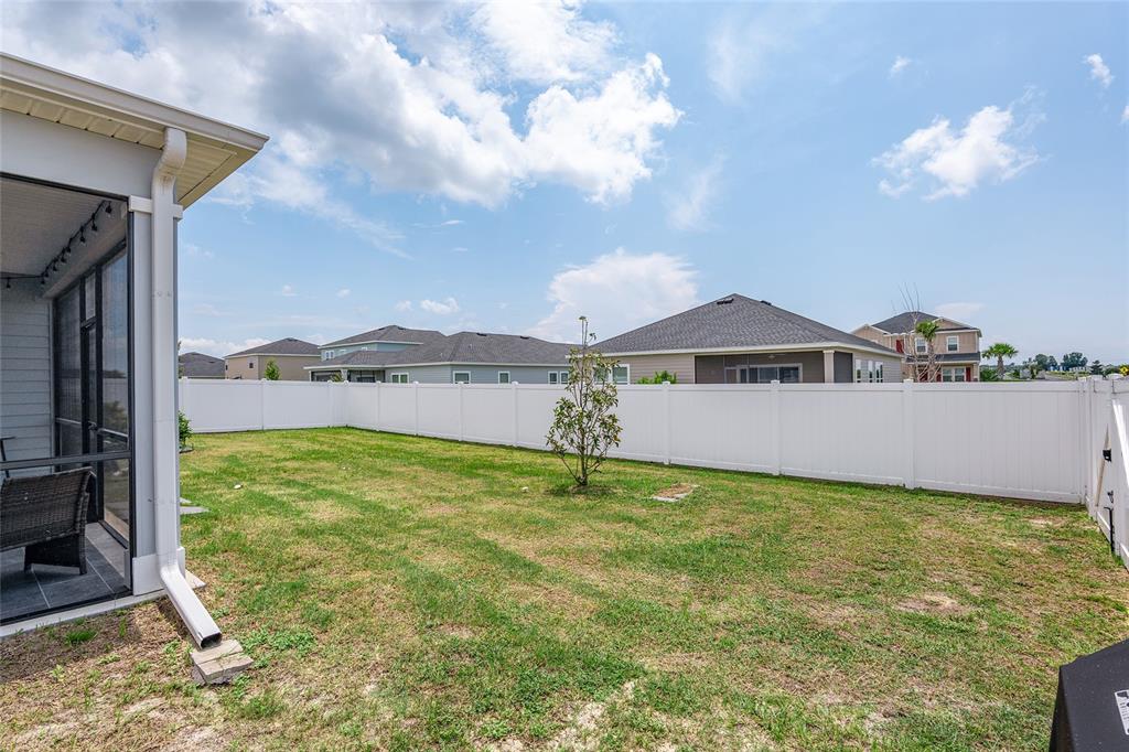 5688 Southwest 92nd Place Ocala, FL 34476 - Photo 49 of 54 a view of a house with a yard