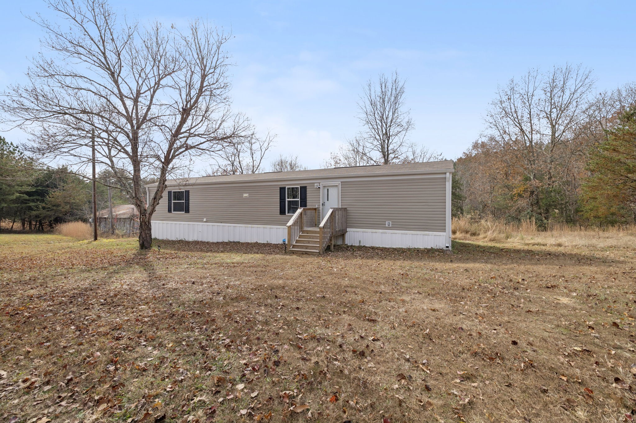 108 Lyell Road Hohenwald, TN 38462 - Photo 3 of 28 a house view with backyard space
