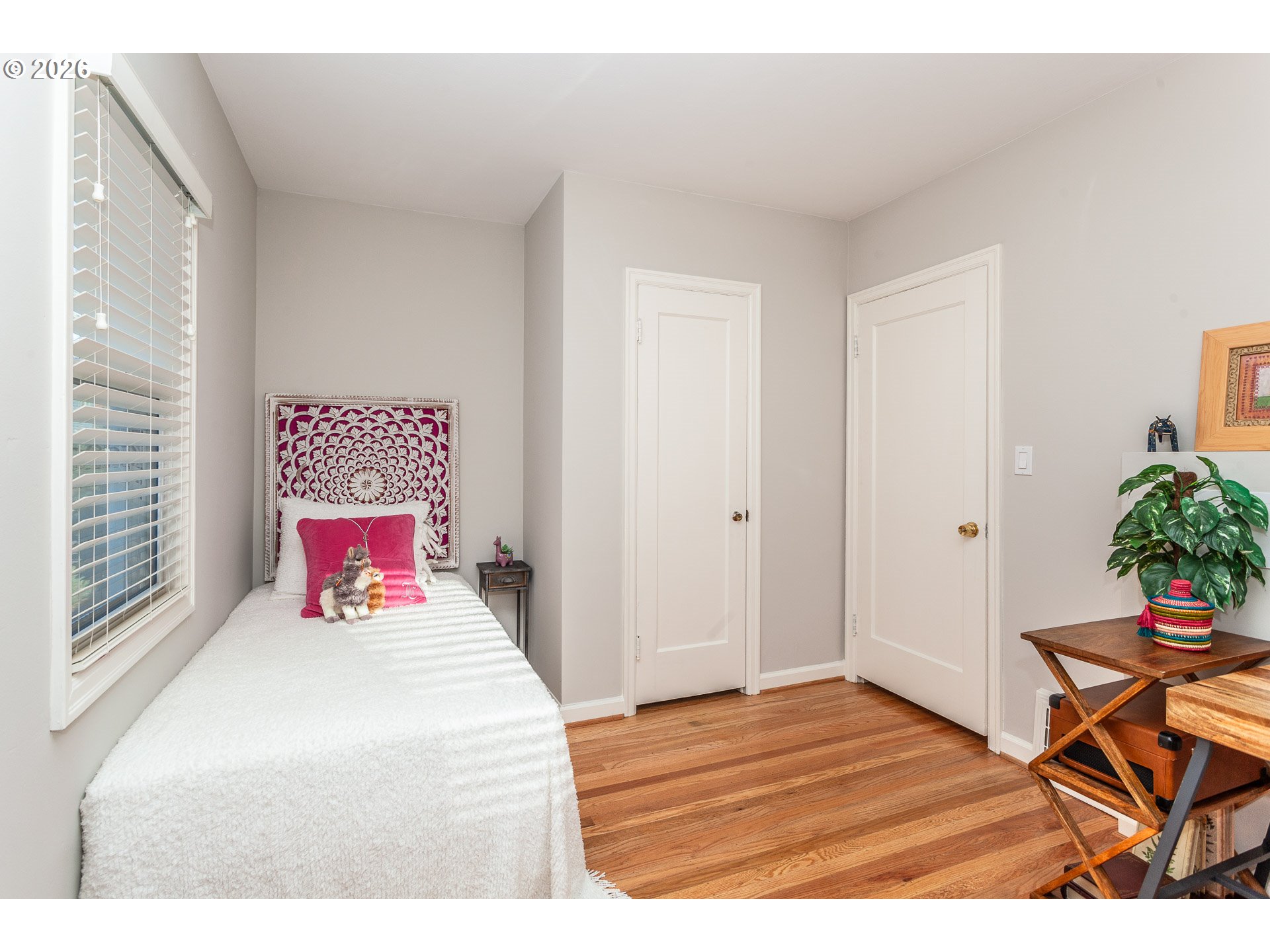 4760 North Harvard Street Portland, OR 97203 - Photo 13 of 43 a bedroom with a bed and a potted plant