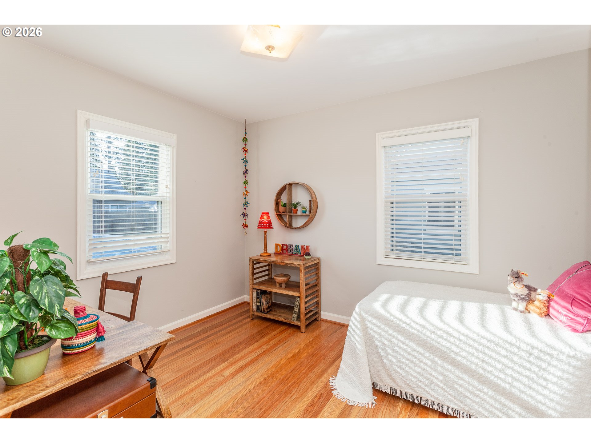 4760 North Harvard Street Portland, OR 97203 - Photo 14 of 43 a bedroom with a bed and a table in it