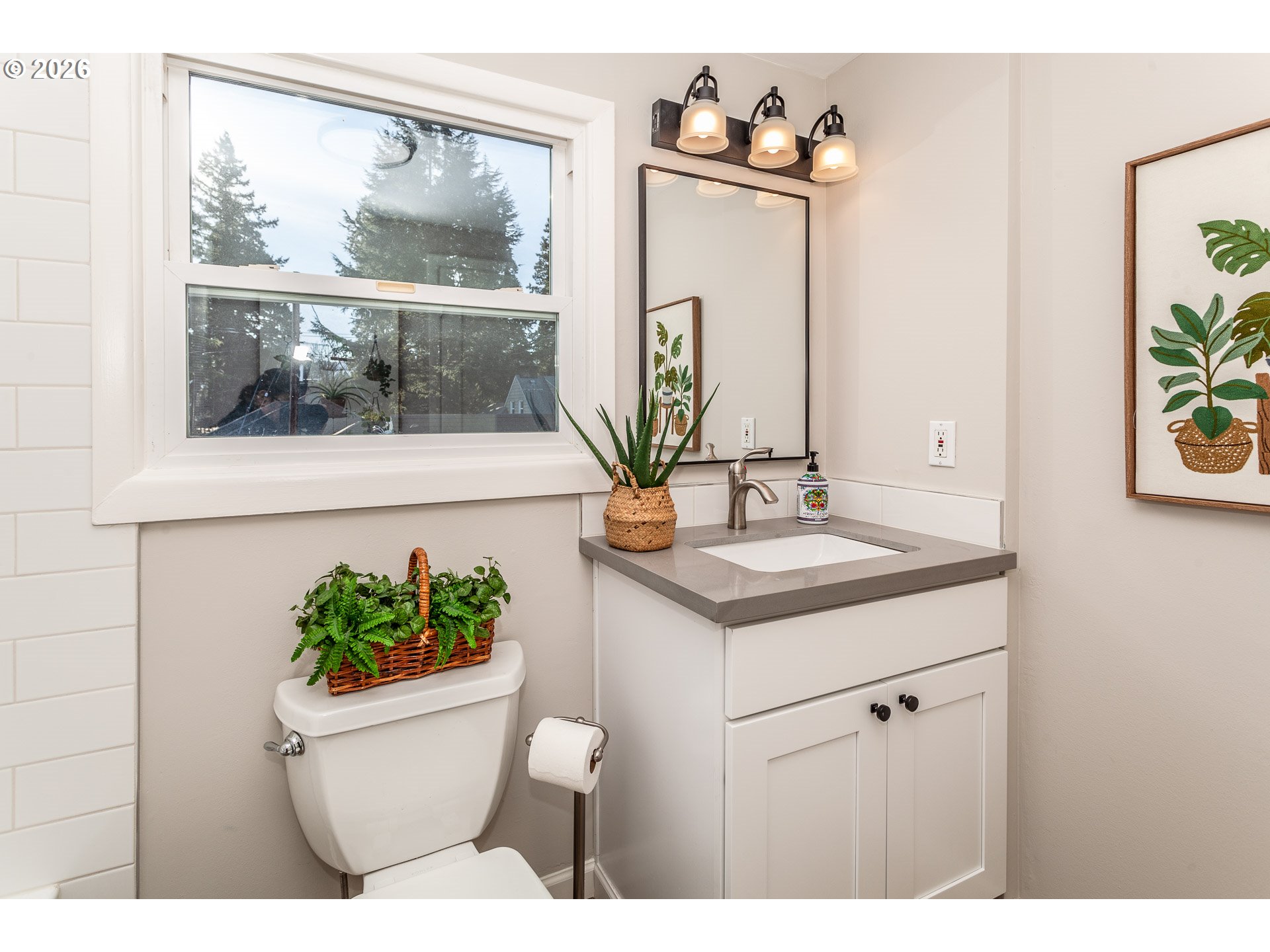 4760 North Harvard Street Portland, OR 97203 - Photo 19 of 43 a bathroom with a toilet a sink and a mirror
