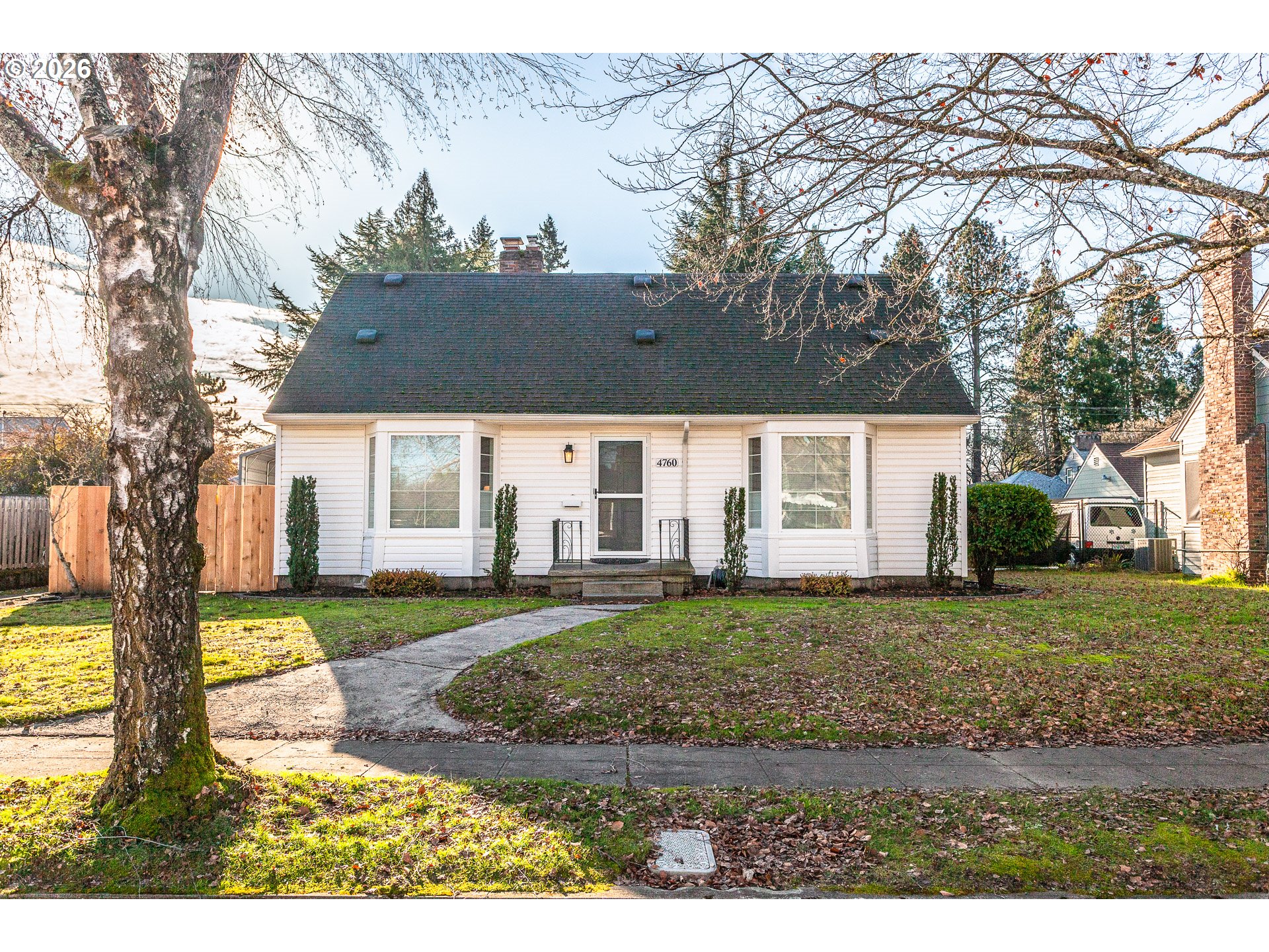 4760 North Harvard Street Portland, OR 97203 - Photo 2 of 43 a view of a house with backyard and trees