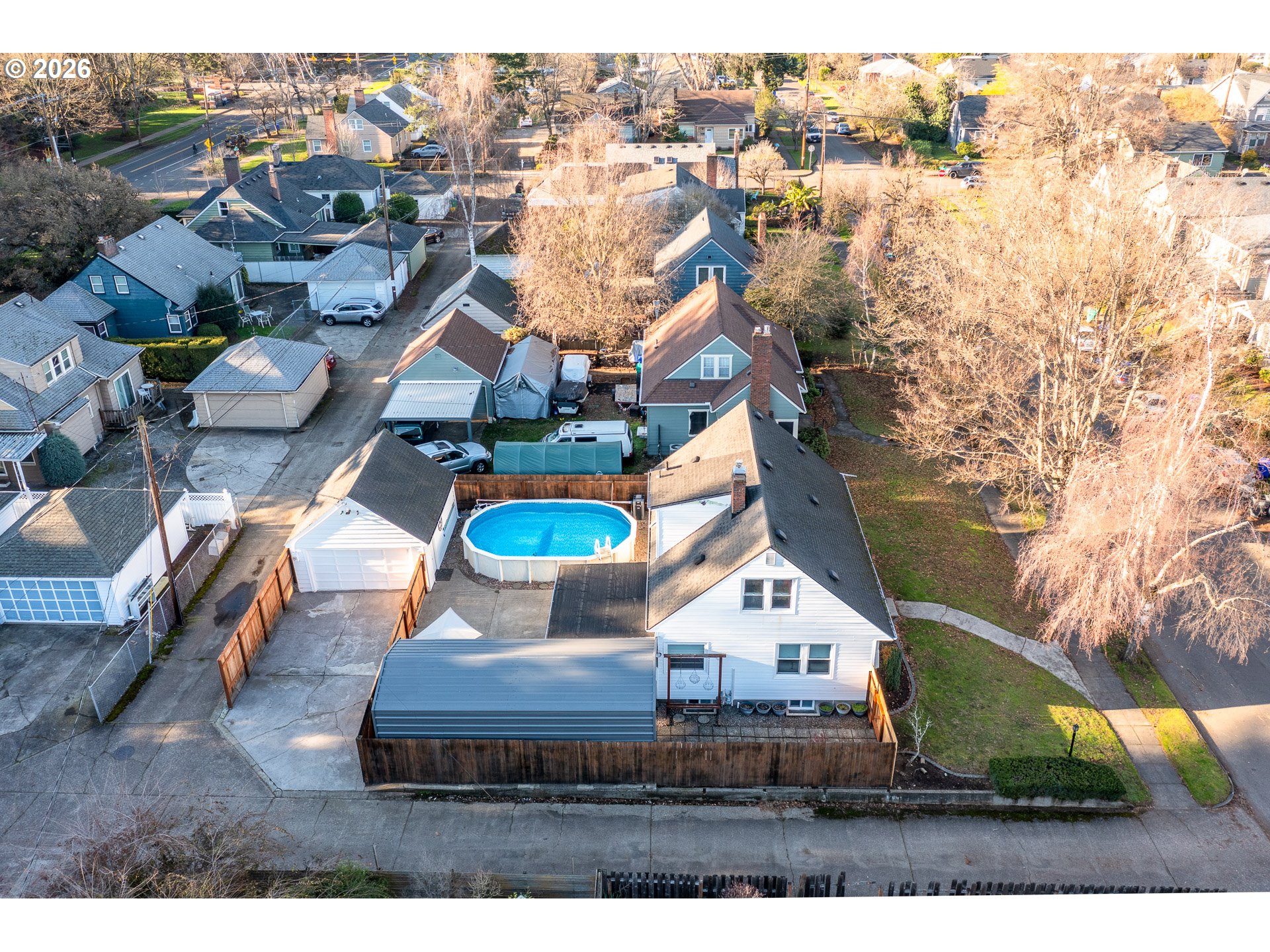 4760 North Harvard Street Portland, OR 97203 - Photo 39 of 43 an aerial view of a house with a garden and lake view