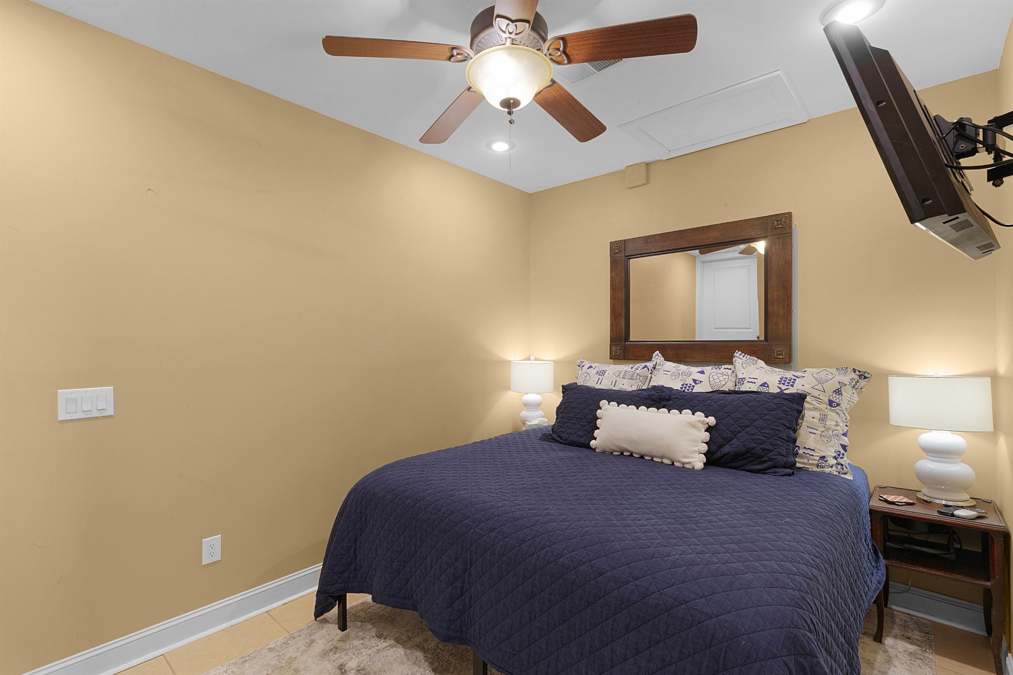 80 Viewpoint Cove Counce, TN 38326 - Photo 16 of 23 a bedroom with a bed and a chandelier