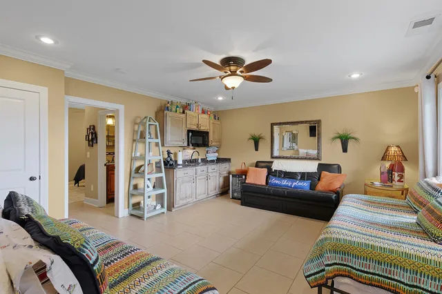 a bedroom with furniture and a chandelier