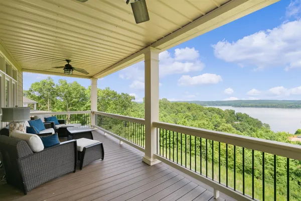 a view of a chair and tables in the balcony