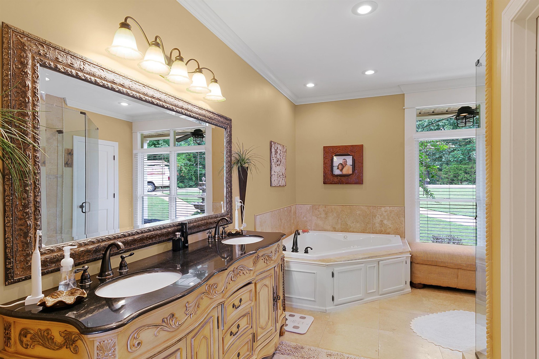 80 Viewpoint Cove Counce, TN 38326 - Photo 9 of 23 a bathroom with a granite countertop double vanity sink a mirror and a bathtub