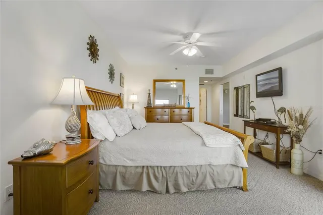 a bed room with a bed and a chandelier