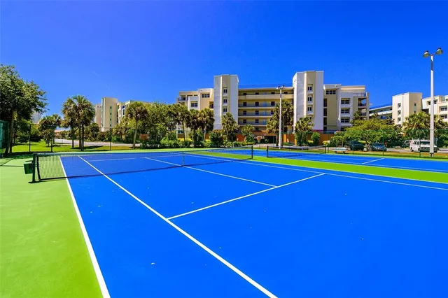 a view of an outdoor space and basketball court