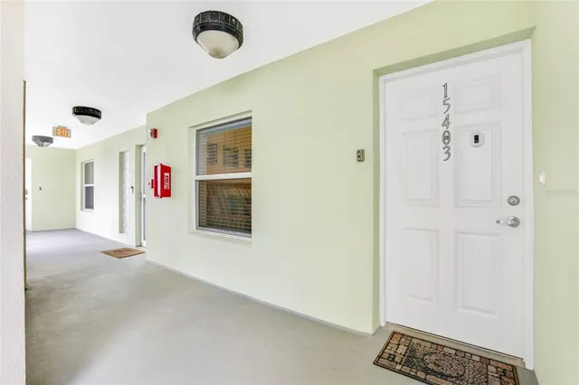 a view of a livingroom with floor to ceiling window