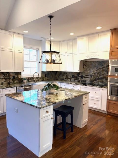 73 Wisdom Cove Road Flat Rock, NC 28731 - Photo 11 of 41 a kitchen with stainless steel appliances granite countertop a sink a stove and a wooden floors