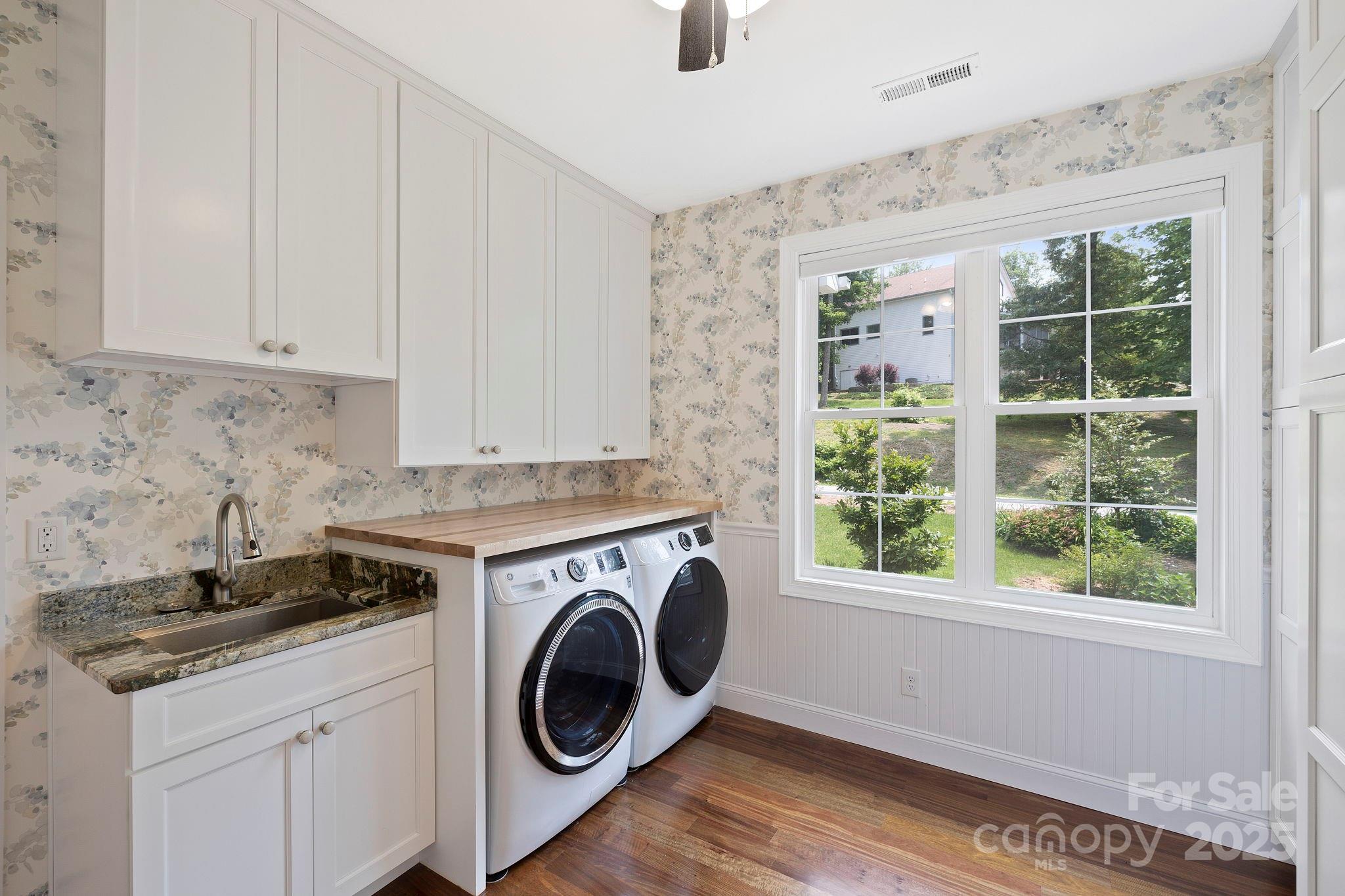 73 Wisdom Cove Road Flat Rock, NC 28731 - Photo 20 of 41 a utility room with sink dryer and washer