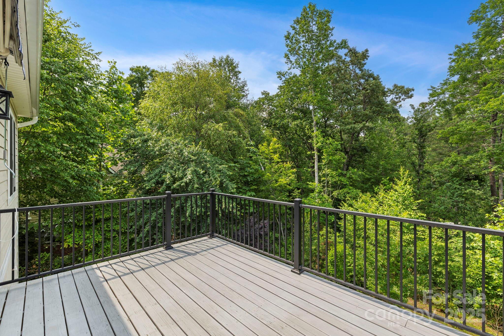 73 Wisdom Cove Road Flat Rock, NC 28731 - Photo 29 of 41 a view of a balcony with wooden floor and fence