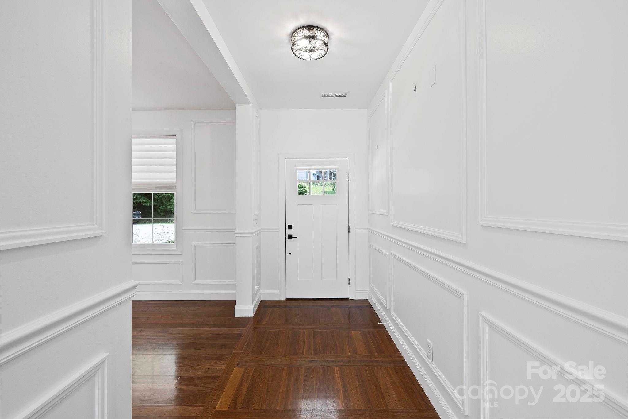 73 Wisdom Cove Road Flat Rock, NC 28731 - Photo 3 of 41 a view of a hallway with wooden floor