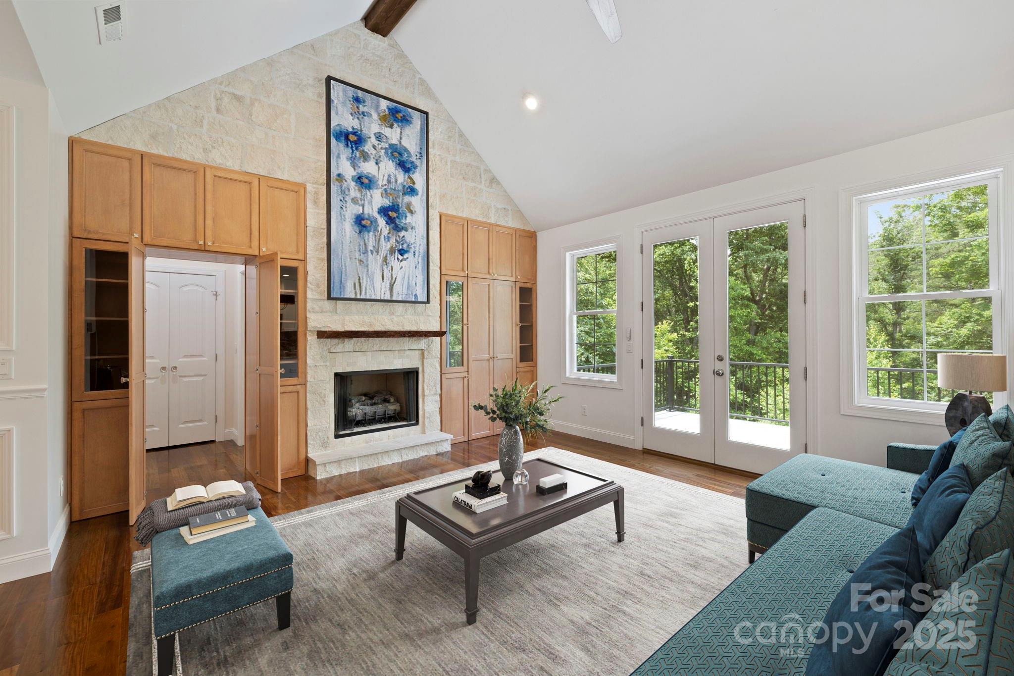73 Wisdom Cove Road Flat Rock, NC 28731 - Photo 6 of 41 a living room with furniture large window and fireplace