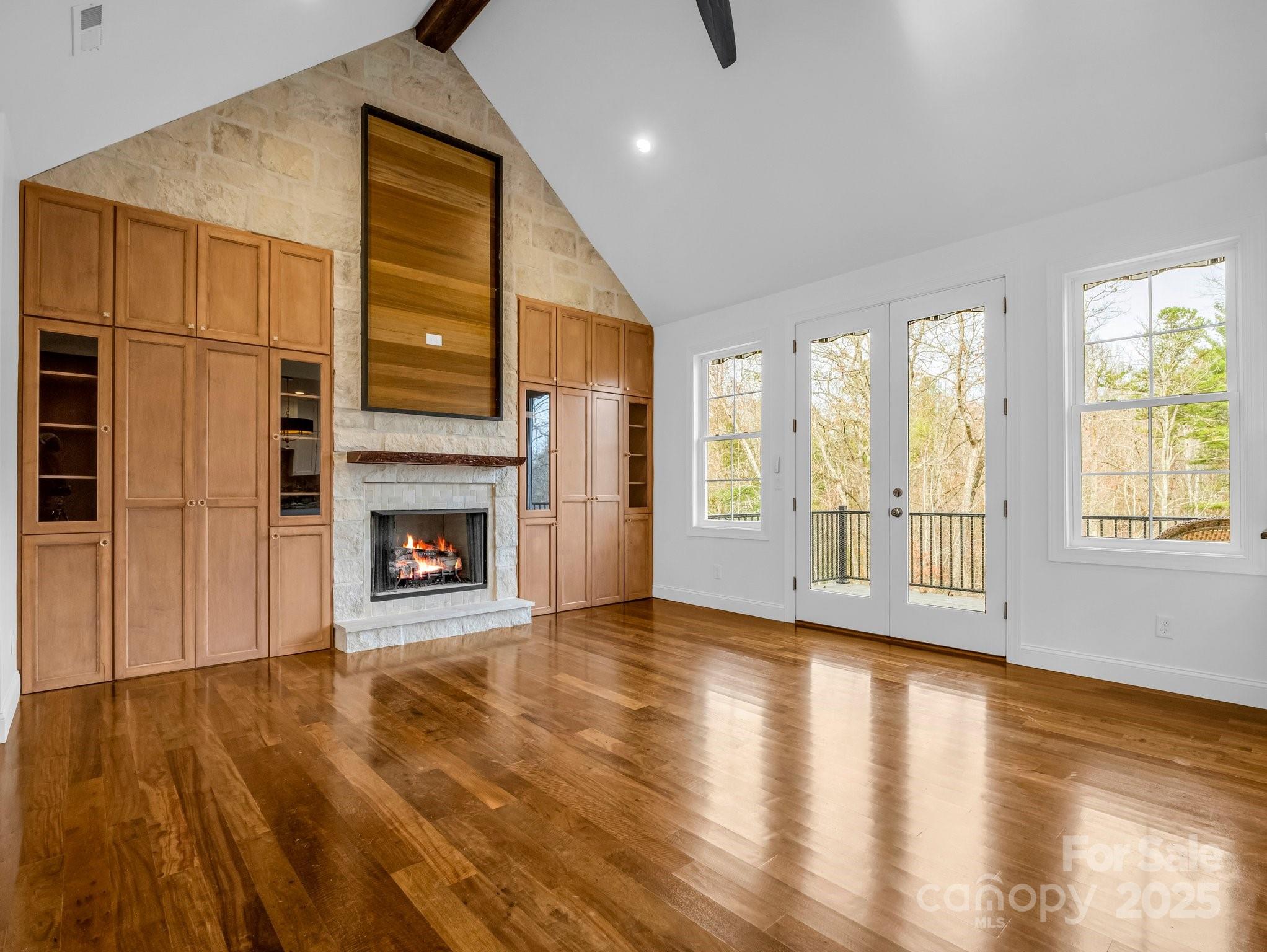 73 Wisdom Cove Road Flat Rock, NC 28731 - Photo 8 of 41 a view of an empty room with glass door and wooden floor