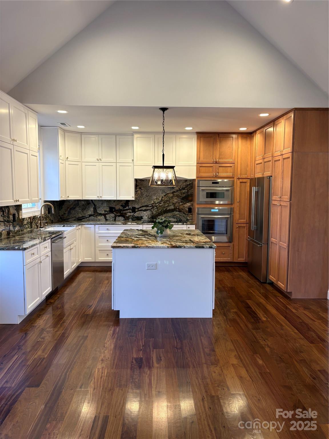 73 Wisdom Cove Road Flat Rock, NC 28731 - Photo 10 of 41 a large kitchen with lots of counter space and wooden floor
