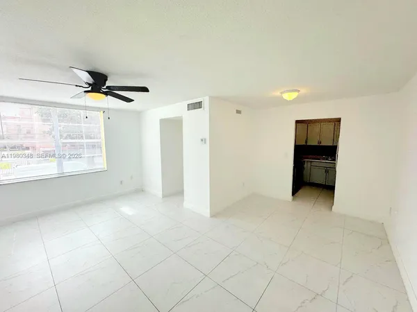 a view of an empty room with a window