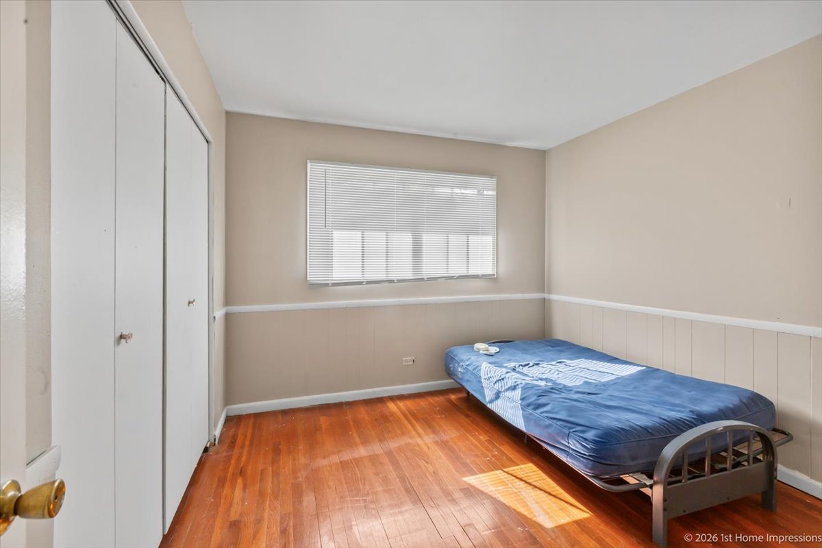 18847 May Avenue Homewood, IL 60430 - Photo 16 of 26 a bedroom with a bed and a window