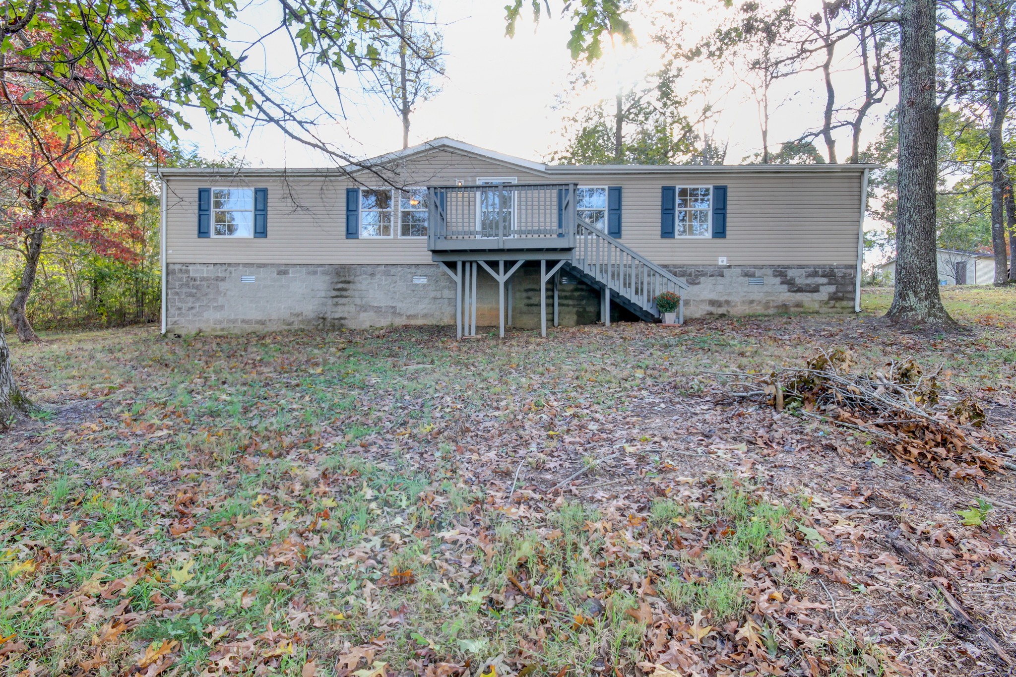145 Trotter Road Cunningham, TN 37052 - Photo 3 of 48 a view of a house with backyard and a tree