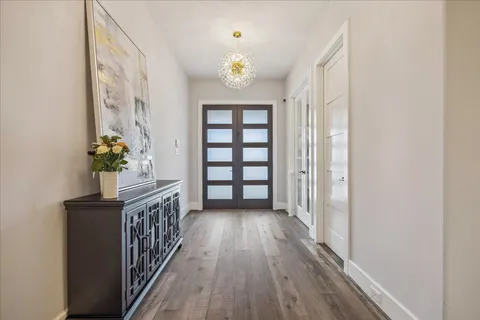 a view of entryway with wooden floor