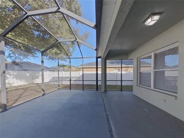 a view of an empty room with a balcony