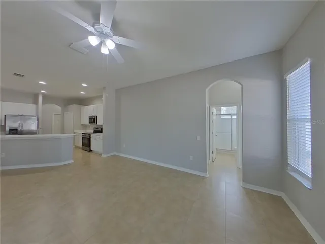 a view of a livingroom with a kitchen