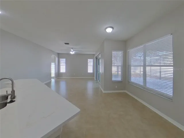 a view of a room window and wooden floor