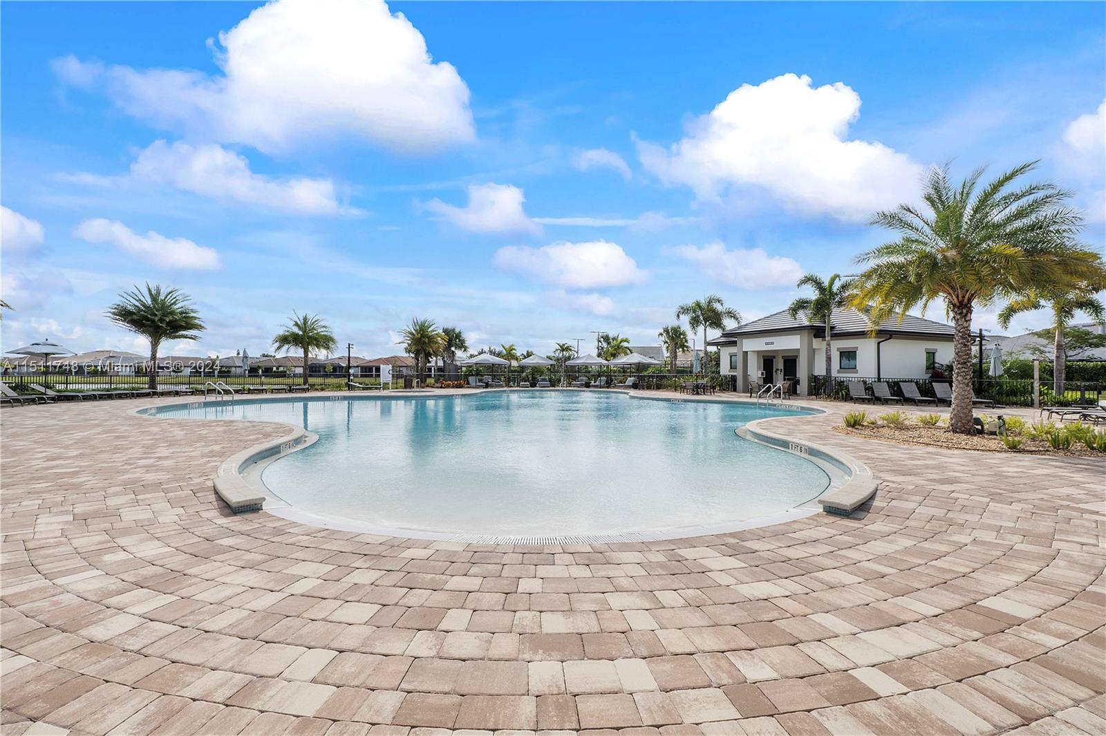 8339 Cadre Noir Road Lake Worth, FL 33467 - Photo 13 of 44 a swimming pool with view of lake
