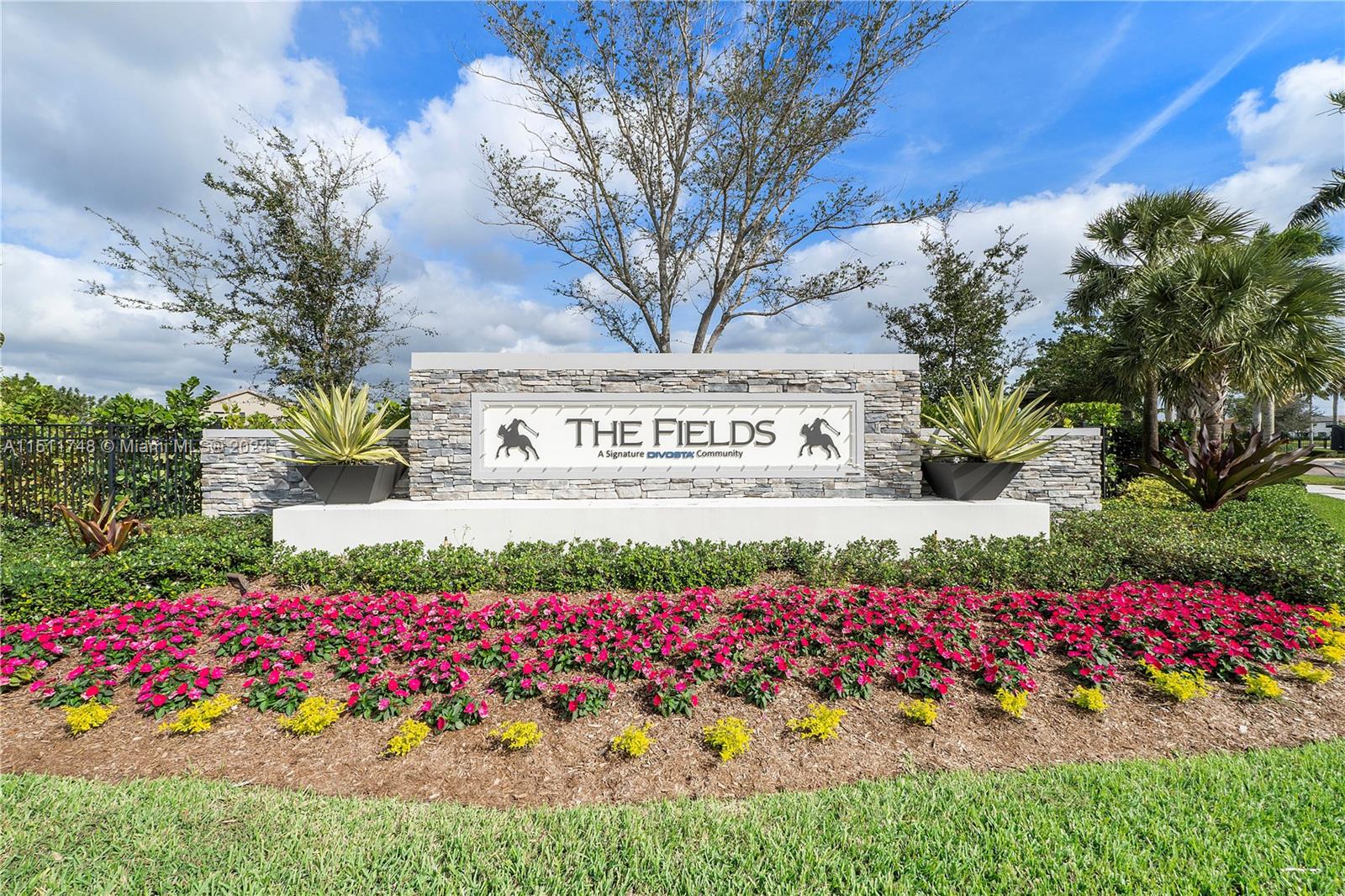 8339 Cadre Noir Road Lake Worth, FL 33467 - Photo 15 of 44 a view of a bunch of flowers