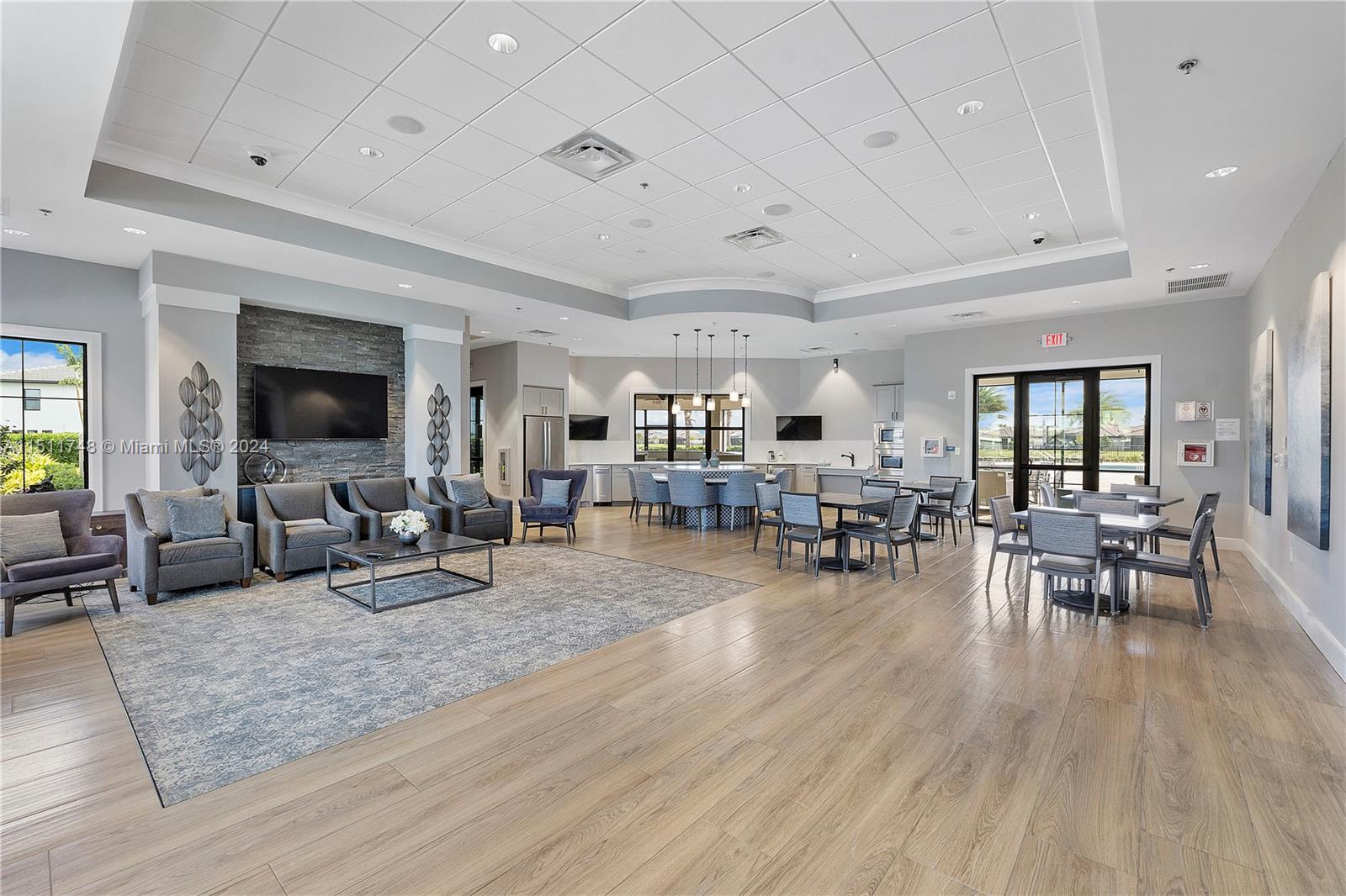 8339 Cadre Noir Road Lake Worth, FL 33467 - Photo 18 of 44 a living room with furniture and wooden floor