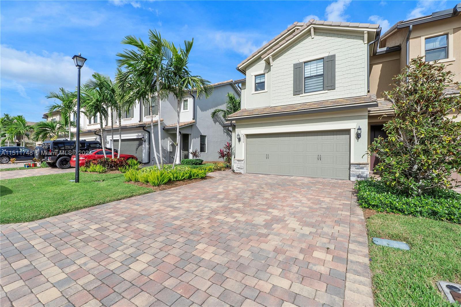 8339 Cadre Noir Road Lake Worth, FL 33467 - Photo 22 of 44 a front view of house with yard and green space